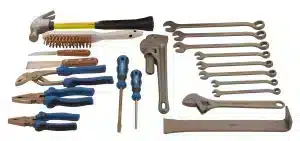 Assortment of Ampco non-sparking hand tools, including hammers, wrenches, pliers, and screwdrivers, illustrating a comprehensive toolkit for safe work in hazardous environments.